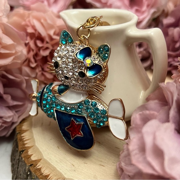 Hello Kitty Flying a Bkue Crystal Airplane Keychain Charm - Picture 5 of 16